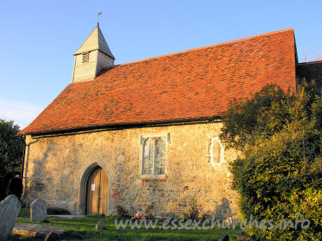All Saints, Vange Church – The S wall of the church, showing the S door, and the blocked Norman window.