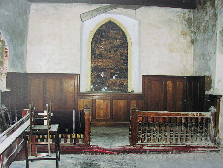 All Saints, Vange Church – The chancel, before work commenced. Note the shattered E window. Fragments of which have been used in the current E window. Again, taken from a picture on display inside the church.