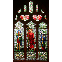 St Mary the Less, Great Warley Church – Stained Glass 4: The banners at the bottom of each of the three main lights read "Devotion", "Love" and "Humility". The wording at the very bottom of the window reads "Greatly loving and greatly loved. To the glory of God and in blessed memory of Evelyn Heseltine 1850 to 1930. His memory dwelleth in righteousness."