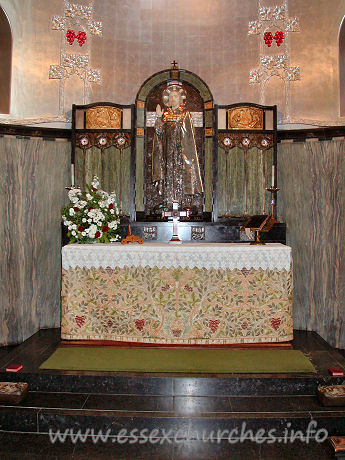 St Mary the Less, Great Warley Church – The chancel lower-wall is covered with a grey-green marble, and the ribbed vault is a metallic colour. The centrepiece of the reredos is a striking figure of Christ. No question of what our attention should be grabbed by here then!