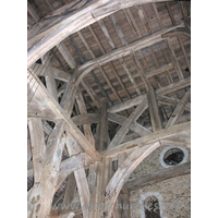 St Laurence, Blackmore Church – Interior 2: From Pevsner's Buildings of England: Essex... Internally it possesses ten posts, making a nave and two aisles. The tower itself stands on the centre six, three N and three S. The arched brances for the cross-beams run N-S, thrown across the second and the fourth pairs. In addition, there are smaller and lower arched braces in an E-W direction between posts 2 and 3, and 3 and 4. Above these are two tiers of cross-struts. A date of c.1480 has been suggested by Mr C.M. Hewett (Archaeological Journal, vol 119, 1962).Tree ring dating in 2004 has now suggested a date of around 1400 for these timbers.