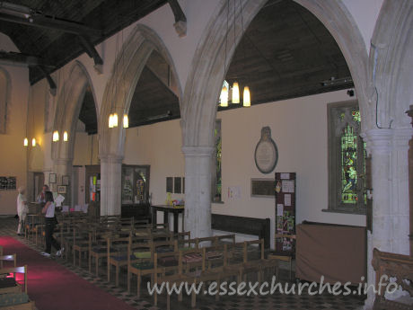 St Laurence, Blackmore Church – Looking towards the W end of the nave. Directly above Julie's head is a Norman window. This is one of a pair of upper windows that can still be seen.