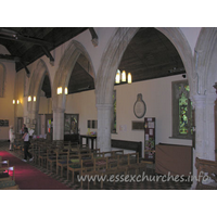 St Laurence, Blackmore Church – Interior 10: Looking towards the W end of the nave. Directly above Julie's head is a Norman window. This is one of a pair of upper windows that can still be seen.