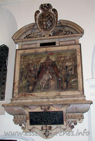 St Margaret, Barking Church – This splendid detail of the monument to Sir Charles Montagu in the chancel, is a wonderfully carved depiction of him in his tent in an army encampment, with his musketeers by his side. The inscription below the monument reads: Heere lieth the Body of Y Worthy Knight S. Charles Montagu; who died at his House at Cranbrook in Essex in the parish of Barking the 11 of September in Y yeere of our Lorde Gpd 1625, being of Y age of 61 yeares, who gave to Y poore of Barking forty pounds