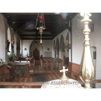 St Peter & St Paul, Hockley Church – Interior 1: This shot of the interior was taken through the east window, looking in above the altar. The four-bay arcade leading into a narrow N aisle can be seen to the right of the picture. The triangularly-headed door at the W end sits within a ogee-shaped W doorway.