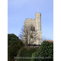 St Clement, Leigh-on-Sea Church – Exterior 3: St Clement's church is best approached from Church Hill. It is a steep climb, but is well worth it as the church suddenly appears from between the trees. Though I doubt this view is possible when that tree is somewhat leafier. The C15 west tower is diagonally buttressed. It has battlements, and the raised stair turret can clearly be seen in this picture. The tower has a west door, and a three-light west window.