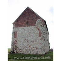 St Peter-on-the-Wall, Bradwell-juxta-Mare Church – Exterior 13: The W wall, clearly showing the arched brickwork where this once joined onto an apsidal chancel. The chancel is marked on the ground. It was demolished once the chapel was put to alternative uses as a barn, sometime in the seventeenth century. Only in the early twentieth century was the building returned to its original use.