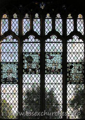 St John the Baptist, Thaxted Church – This stained glass window (and the following four enlargements of the panels within it) depicts Adam and Eve. The original glass in the panels dates from C15.