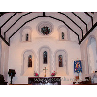 St Helen & St Giles, Rainham Church – Interior 2: Three stepped round headed lancet windows, with a large round window flanked by two narrow slits.