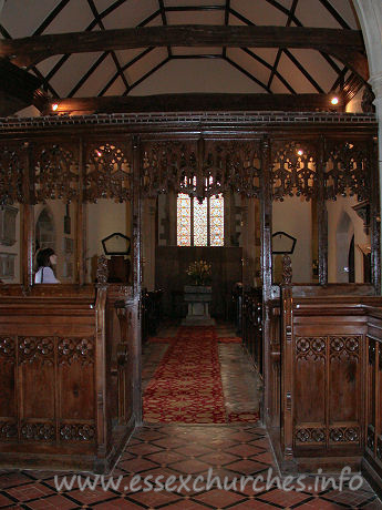 St Edmund, Abbess Roding Church – This view of the nave, looking W from the chancel shows the nave roof tie beams, which are supported on arched braces.