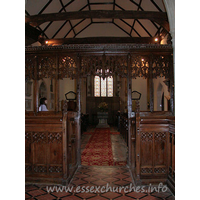 St Edmund, Abbess Roding Church – Interior 3: This view of the nave, looking W from the chancel shows the nave roof tie beams, which are supported on arched braces.