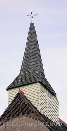 St Mary, Little Burstead Church – The wooden belfry was constructed during the fifteenth century, and rests on six posts with beams on braces. It is crowned by a shingled broach spire.