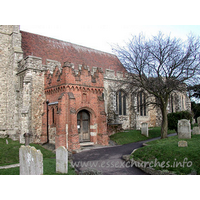 Holy Trinity, Rayleigh Church – Exterior 2: This brick porch conceals a C13 South doorway. The porch itself has two-light brick side windows, and is crowned with stepped battlements upon a trefoil-arched corbel frieze.