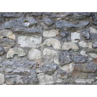 St Mary & All Saints, Great Stambridge Church – Exterior 3: According to ecclesiological historian John Vigar, these strange round shapes are sections of either a pillar, or a pillar piscina. They have been used as rubble during the construction (or repair) of the N chancel wall.