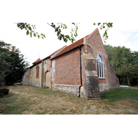 St Mary, Mundon Church – Exterior 3: The south wall here shows the blocked S chapel archway, and the brick window, both dated early C16.