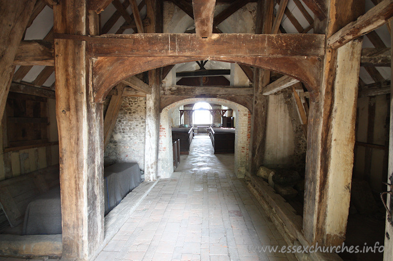 St Mary, Mundon Church – Looking through the arch in the nave west wall. This view clearly shows the S 'aisle', and the entrance to the N 'aisle'.
