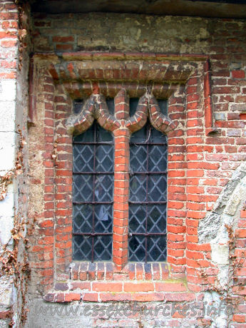 All Saints, Berners Roding Church – An early C16 brick window in the S wall.