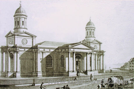 St Mary (Old Church), Mistley Church – The church before demolition of the nave, around 1871. The portico columns have been re-used on each of the now free-standing towers, to continue the pattern of the buttressing.