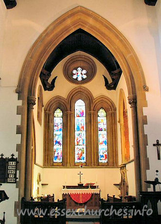 St Mary, Langdon Hills New Church – Above the lancet windows in the chancel, at either side, can be seen two angels. There are, in fact, eight angels in the chancel, and eight in the nave. This image was supplied by Ken Porter.