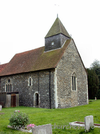All Saints, Sutton Church – The north wall, clearly showing a Norman window in the nave.