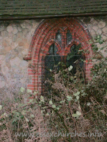 All Saints, North Benfleet Church – In the north chancel wall, an early C16 brick window, with two-light panel tracery.