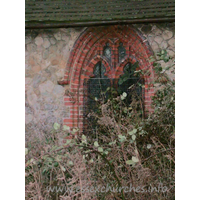 All Saints, North Benfleet Church – Exterior 5: In the north chancel wall, an early C16 brick window, with two-light panel tracery.