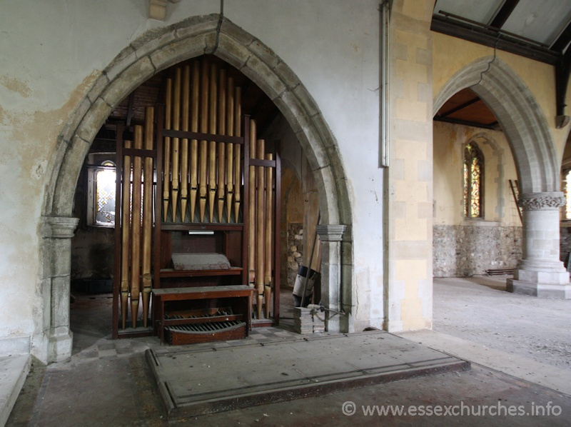 St John the Baptist, Mucking Church – The organ in the arcade seperating the chancel and S chapel.