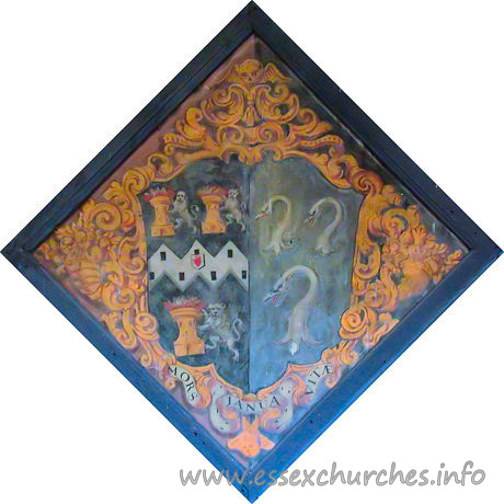 St Michael, Theydon Mount Church – This hatchment was for Anne Hedges d. 1719, who was the first wife of Sir Edward Smyth, 3rd Bt. Although rather faded, the left-hand side of the hatchment appears to have been white when it was created, showing that Anne was survived by her husband.