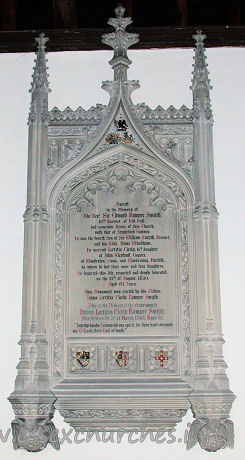 St Michael, Theydon Mount Church – Large Perpendicular Gothic tablet to Rev Sir Edward Bowyer Smith d.1850, by Osmond, Sarum. Sacred to the Memory of The Revd Sir Edward Bowyer Smijth. 10th Baronet of Hill Hall; and sometime Rector of this Church, with that of Stapleford Tawney. He was the fourth Son of Sir William Smijth, Baronet, and his Wife, Anne Windham. He married Laetitia Cicely, 6th daughter of John Weyland, Esquire, of Woodraton, Oxon, and Woodrising, Norfolk, by whom he had three sons and four daughters. He departed this life, respected and deeply lamented, on the 15th of August, 1850. Aged 65 Years. This Monument was erected by his Widow Dame Laetitia Cicily Bowyer Smijth. Also to the Memory of the above-named Dame Laetitia Cicely Bowyer Smijth. She died on the 3rd of March 1863, Aged 31 [???] "Into thy hands I commend my spirit, for thou hast redeemed me. Oh Lord, thou God of truth."
