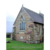 St Lawrence & All Saints, Steeple Church – Exterior 1: This church's most distinctive feature is its masonry. Built by architect F. Chancellor, 1884, his brown stone walls have mixed in, completely randomly, bricks at all angles.