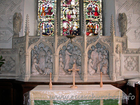 St Margaret of Antioch, Margaretting Church – The fine reredos, beneath the Jesse window.