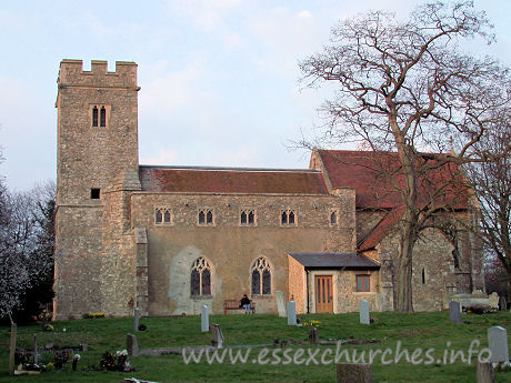 St Nicholas, Rawreth Church – This view from the south shows the mismatch of the different parts of the church. One would perhaps expect that it was the chancel that was built at a different time to the nave, but in fact, both were built in 1882. The only exceptions to this date are the tower, the S aisle and (not shown) the W wall of the N aisle. My lovely Julie poses for us once again in front of the nave.