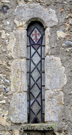 Dedication Unknown, Mashbury Church – One of two Norman windows in the north wall.