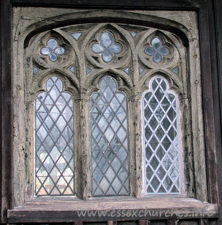 All Saints, Stock Harvard Church – Three-light traceried wooden window.