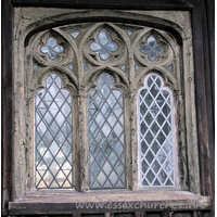 All Saints, Stock Harvard Church – Exterior 4: Three-light traceried wooden window.