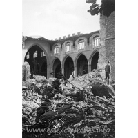 St Peter Ad Vincula, Coggeshall Church – Postcard 7: One of a series of 8 photos bought on eBay. Photographer unknown. "From the foot of the Tower showing destruction of the North Wall and roof." - dated September 1940.