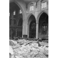 St Peter Ad Vincula, Coggeshall Church – Postcard 8: One of a series of 8 photos bought on eBay. Photographer unknown. "From where the North wall previously stood - showing part of undamaged chancel and South aisle." - dated September 1940.