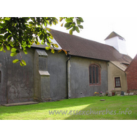 St James, Little Clacton Church – Exterior 4: The N side of the church, showing a brick window (likely C16) in the nave wall.