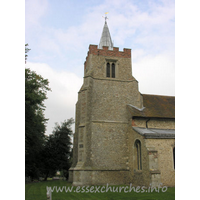 St Mary the Virgin, Henham Church – Exterior 4: The tower dates from C14. It has diagonal buttresses, which extend into the nave, underpinned by a squinch. The brick battlements are later, as is the lead 'spike' spire.