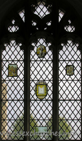 St Nicholas, Elmdon Church – The 17th century painted glass in this window was removed from St Dunstan's Church, Wenden Lofts, during demolition of that church. A.D. 1958.