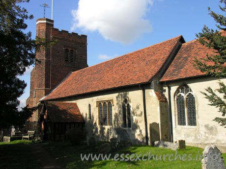 All Saints, Nazeing Church – A similar shot, though this time showing a little of the external chancel wall. The Norman nave window is clearly visible, just to the right of the porch. The fine C16 tower is also evident here, with it's blue diapering, battlements and raised stair turret.