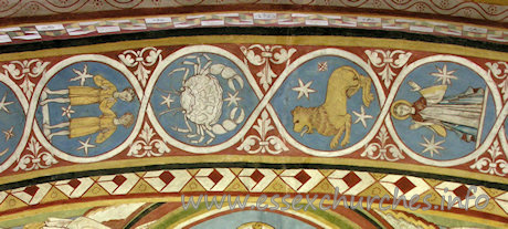 St Michael & All Angels, Copford Church – The centre part of the underneath of the chancel arch, which depicts all 12 signs of the zodiac. From left to right can be seen: Gemini, Cancer, Leo and Virgo.