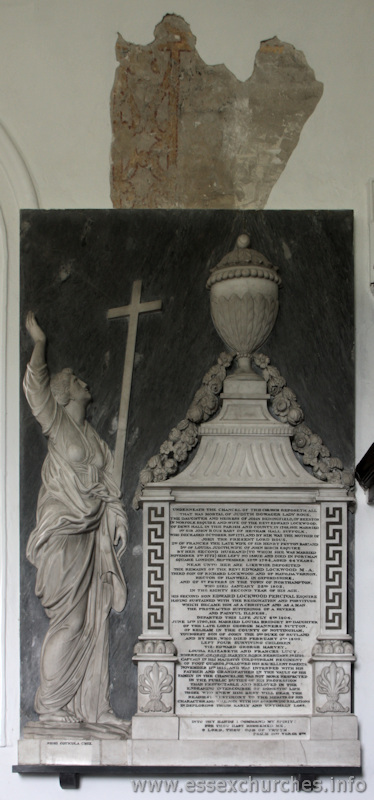 St Mary & All Saints, Lambourne Church – Underneath the chancel of this church reposeth all that was mortal of Judith Dowager, Lady Rous, the daughter and heiress of John Bedingfield of Beeston in Norfolk Esq, and wife of the Revd. Edward Lockwood, of Dews Hall in this parish and county. In 1749, she married 1st Sir John Rous Baronet of Henham Hall, Suffolk, who deceased October 31st 1771, and by him was the mother of John the present Lord Rous. 2nd of Frances the late wife of Sir Henry Peyton Baronet and 3rd of Louisa Judith, wife of John Birch Esquire. By her second husband (to whom she was married November 3rd 1772) she left no issue and died in Portman Square, London, September 10th 1794, aged 64 years. Near unto her are likewise deposited the remains of Revd. Edward Lockwood M.A., third son of Richard Lockwood and Matilda Vernon, rector of Hanwell in Oxfordshire and of St Peters in the town of Northampton, who died January 22nd 1802 in the eighty second year of his age. His second son, Edward Lockwood Percival Esquire having sustained with the resignation and fortitude which became him as a Christian and as a man the protracted sufferings of a severe and painful illness, departed this life July 6th 1804. June 15th 1790, he married Louisa Bridger 2nd daughter of the late Lord George Manners Sutton, of Kelham in the county of Nottingham, youngest son of John the 3rd Duke of Rutland and by her, who died February 5th 1800, left four surviving children viz: Edward George Harvey, Louisa Elizabeth and Frances Lucy, whereof George Harvey born February 1st 1793 captain in his Majesty's coldstream regiment of footguards, followed his excellent parents November 11th 1815, and was interred with his father and grandfather in the vault of his family in the chancel; he was not more respected in the public duties of his profession than respectable and beloved in the endearing intercourse of domestic life. Those who knew him best will bear the readiest testimony to the merits of his character and will join his sorrowing relations in deploring their early and untimely loss. Into thy hands I commend my spirit: for thou hast redeemed me, o Lord, thou God of Truth. Psalm 31 verse 6th [should be 5].