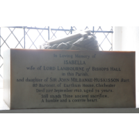 St Mary & All Saints, Lambourne Church – Monument 16: In loving memory of Isabella wife of Lord Lambourne of Bishops Hall in this parish, and daughter of Sir John Milbanke-Huskisson Bart. 8th Baronet of Eartham House, Chichester. Died 22nd September 1923, aged 74 years. "Still stands thine ancient sacrifice, a humble and contrite heart."